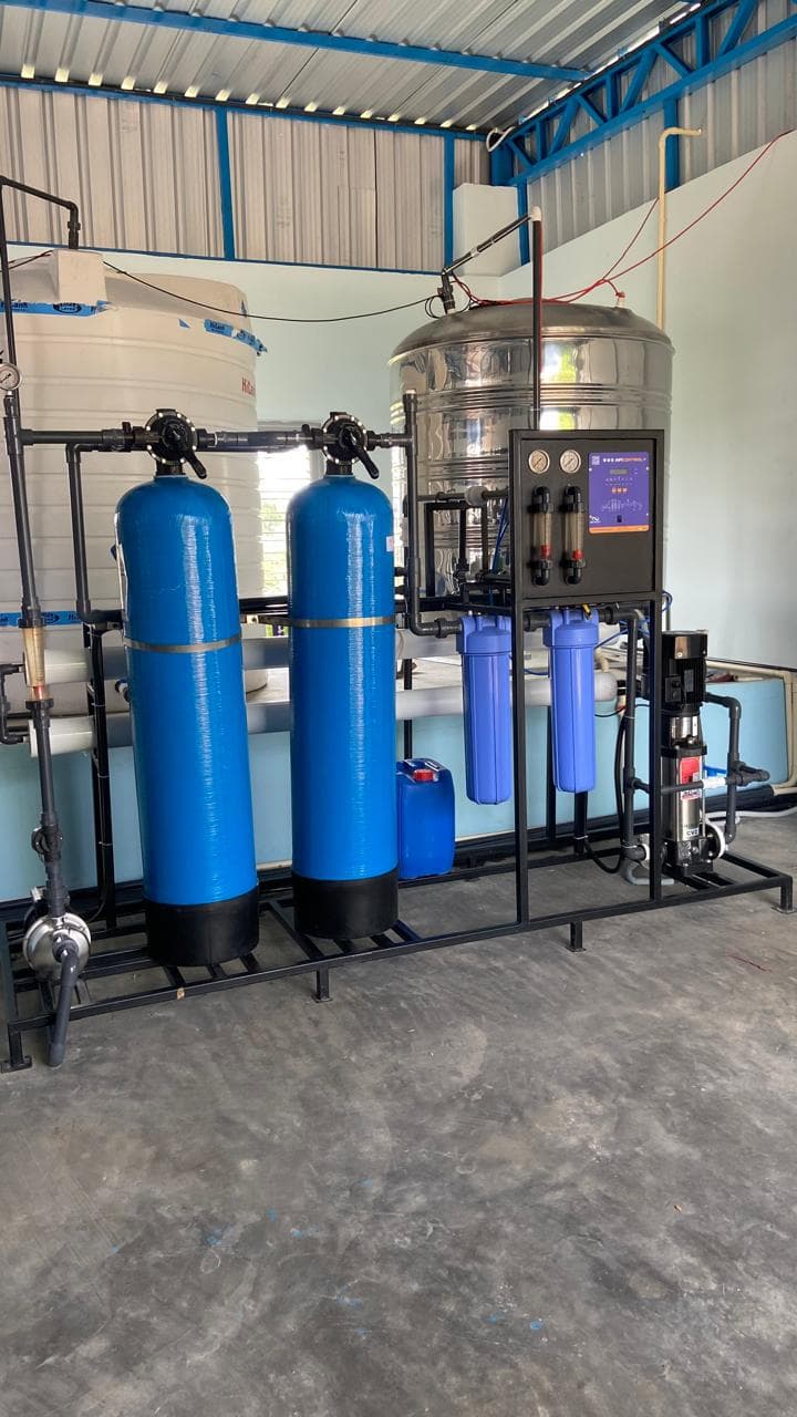 Blue FRP pre-treatment vessels for raw water softening and carbon filtration.